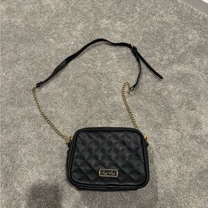Itzy Ritzy Black Double Take Crossbody Diaper Bag in vegan leather
